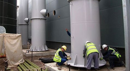 Steel Chimney inspection, 3 men inspection a white chimney