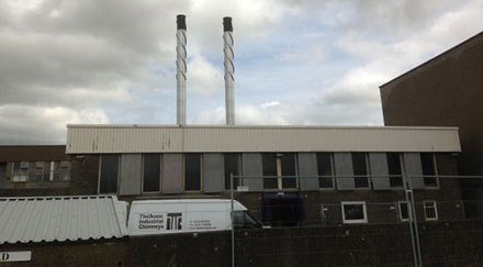 Industrial steel chimneys with black tops