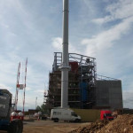 Thelkane Industrial Chimneys Ltd van in front of large chimney system