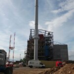Thelkane Industrial Chimneys Ltd van in front of large chimney system